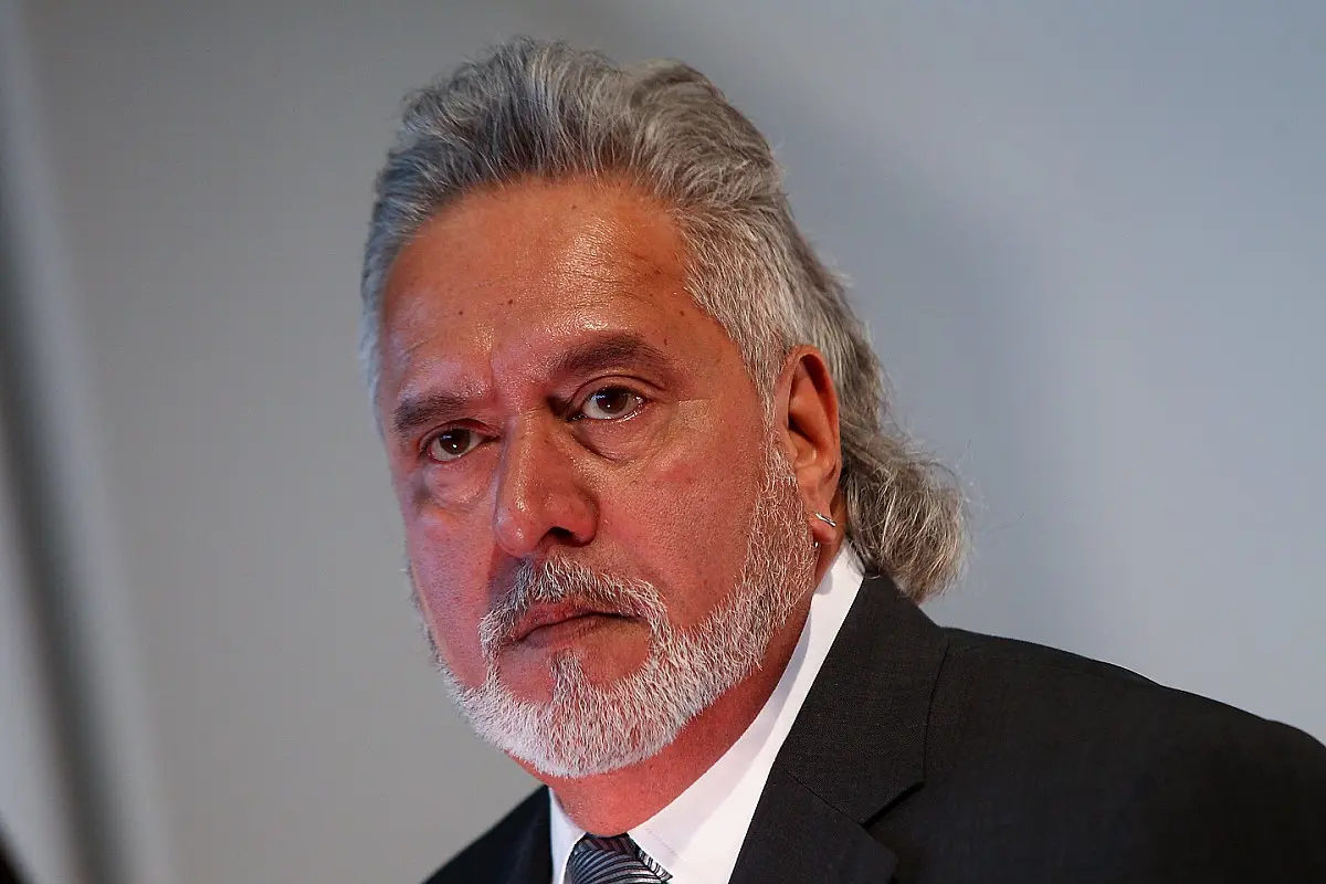 ferrari f1 logo y force india logo - Qué pasó con Vijay Mallya