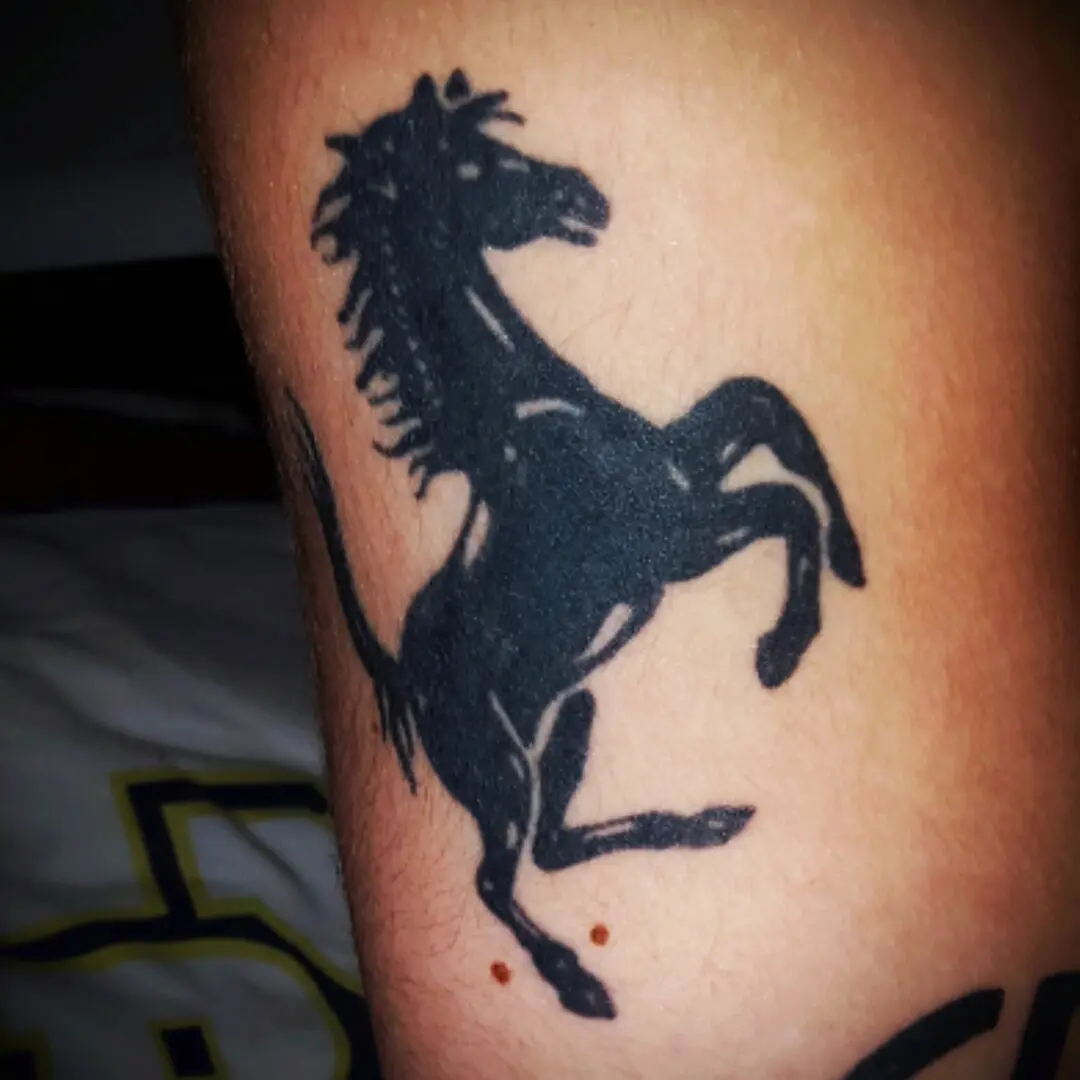 ferrari horse tattoo - What does the horse tattoo mean